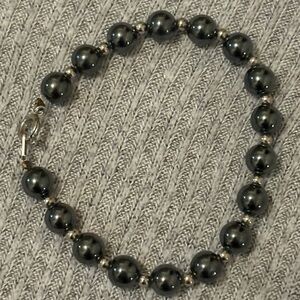 Vintage hematite bracelet with silver colored beads in between the hematite
